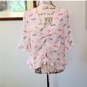Elodie glasses print cropped and ruffled top.